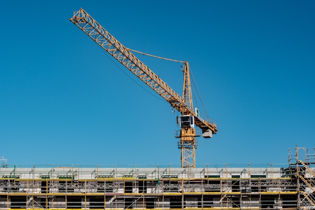 Two Construction Workers Overseeing Job Site