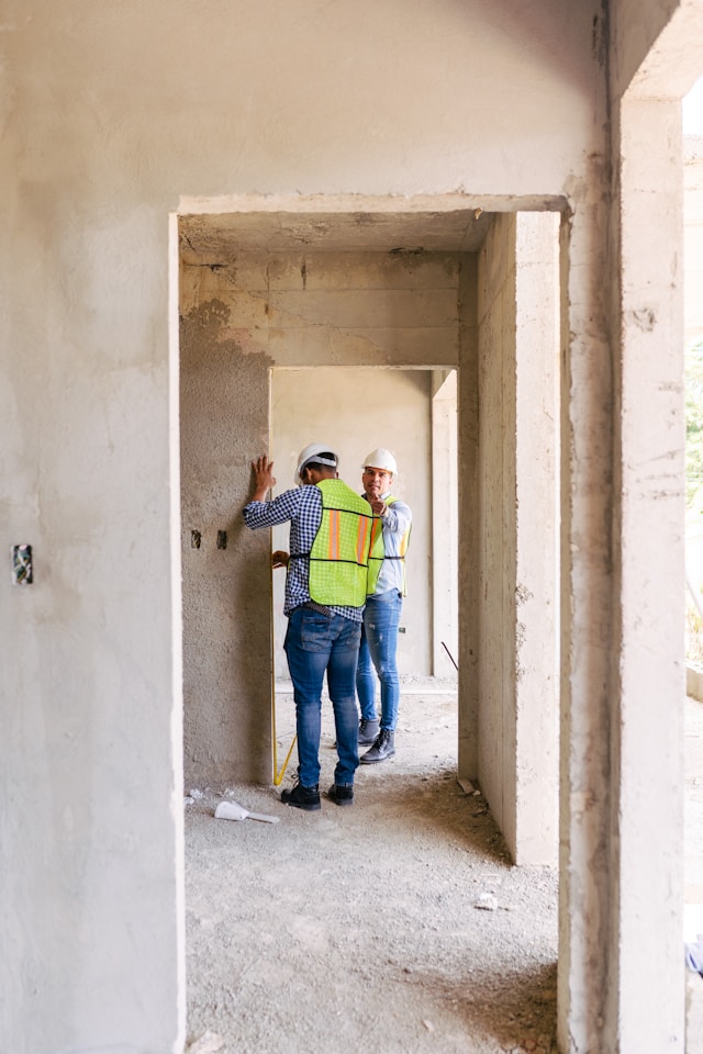 Close,Up,Of,Civil,Male,Engineer,Asian,Working,On,Blueprint